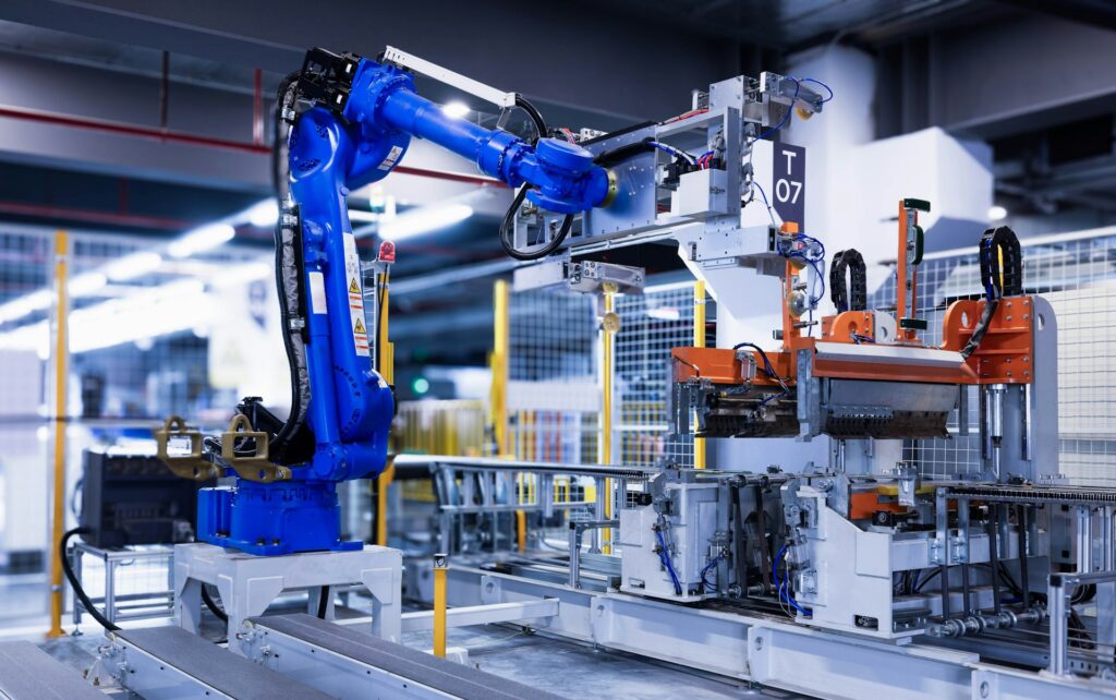 Industrial robot arm on an automated factory line